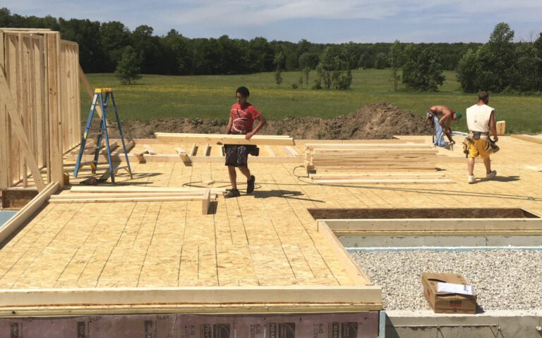 carpentry-worker-framing-a-home-from-the-foundation