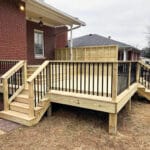 custom-deck-build-outside-of-a-brick-house