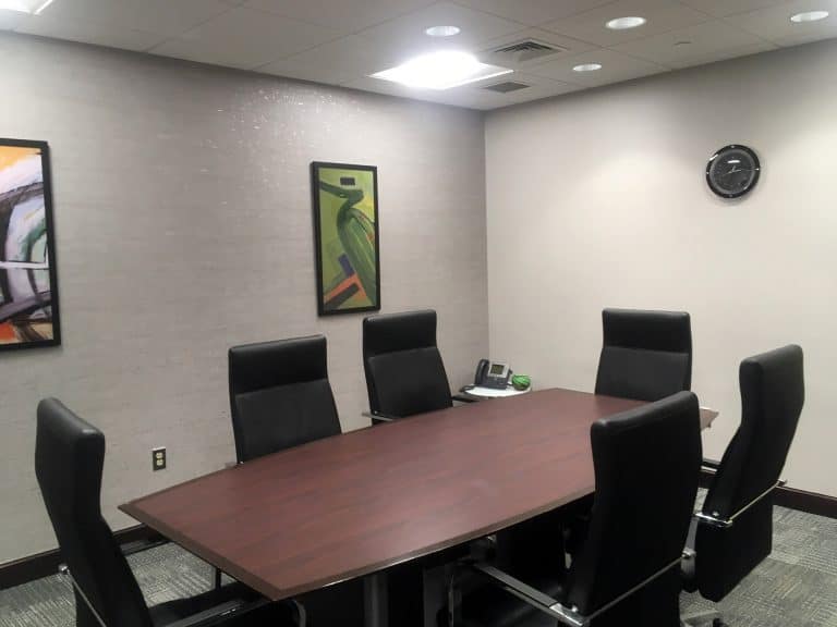 office-board-room-with-black-chairs-and-wooden-table