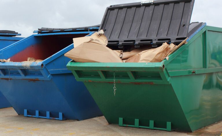 two-commercial-dumpsters-full-of-trash